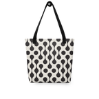 A tote bag with a black and off-white wavy dot pattern, featuring black shoulder straps and a black top handle.