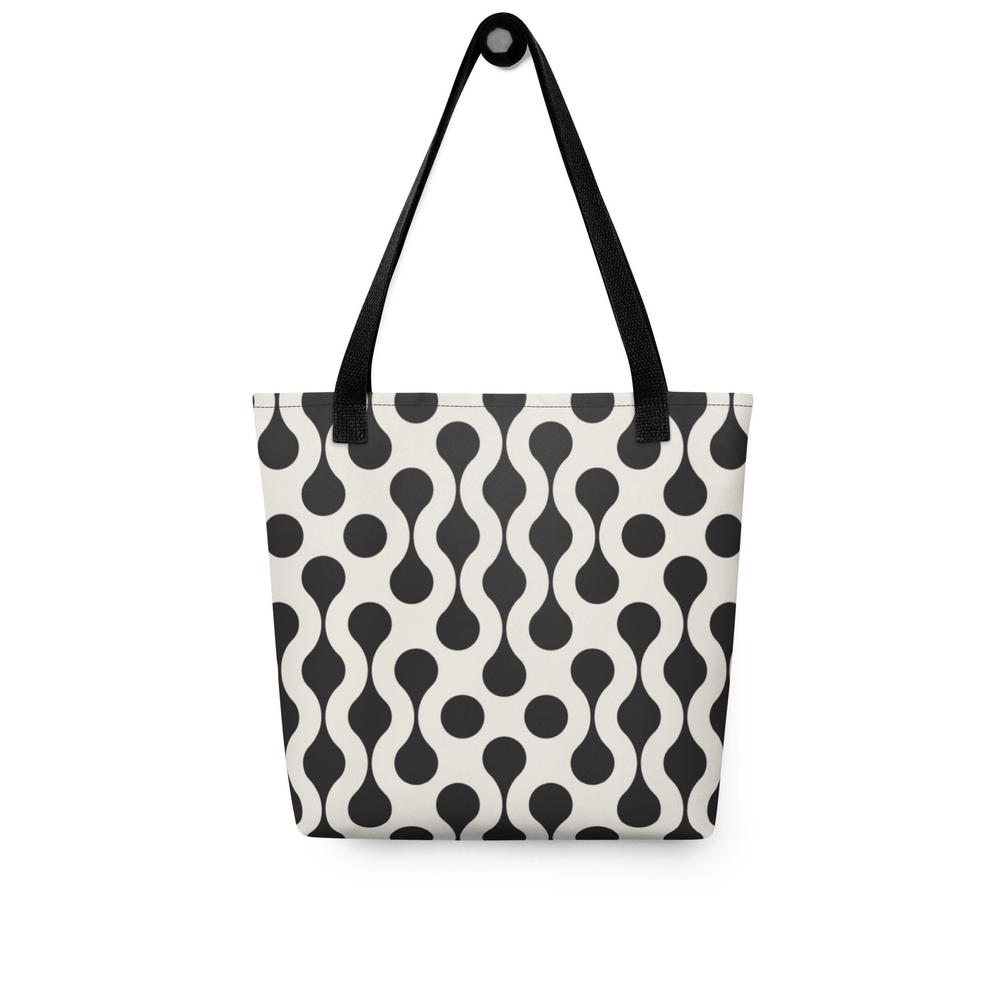 A tote bag with a black and off-white wavy dot pattern, featuring black shoulder straps and a black top handle.