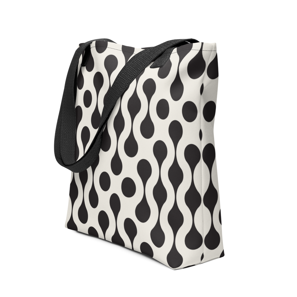 Tote bag with black strap and black and white pattern.