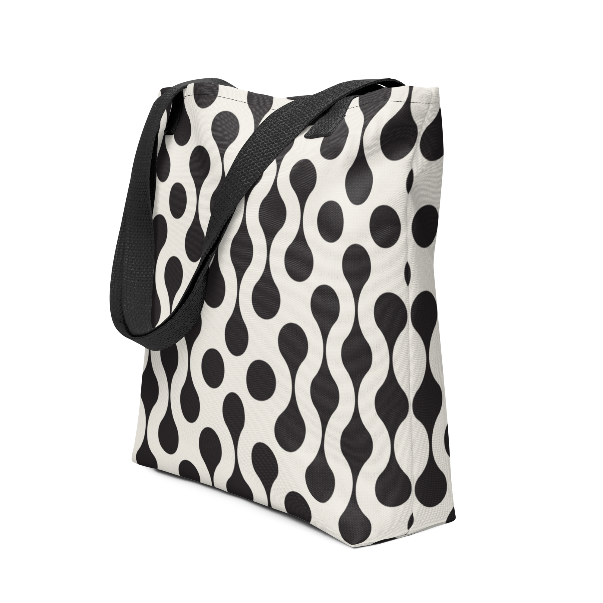 Tote bag with black strap and black and white pattern.