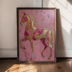 Framed artwork of a pink and gold horse on a pink background
